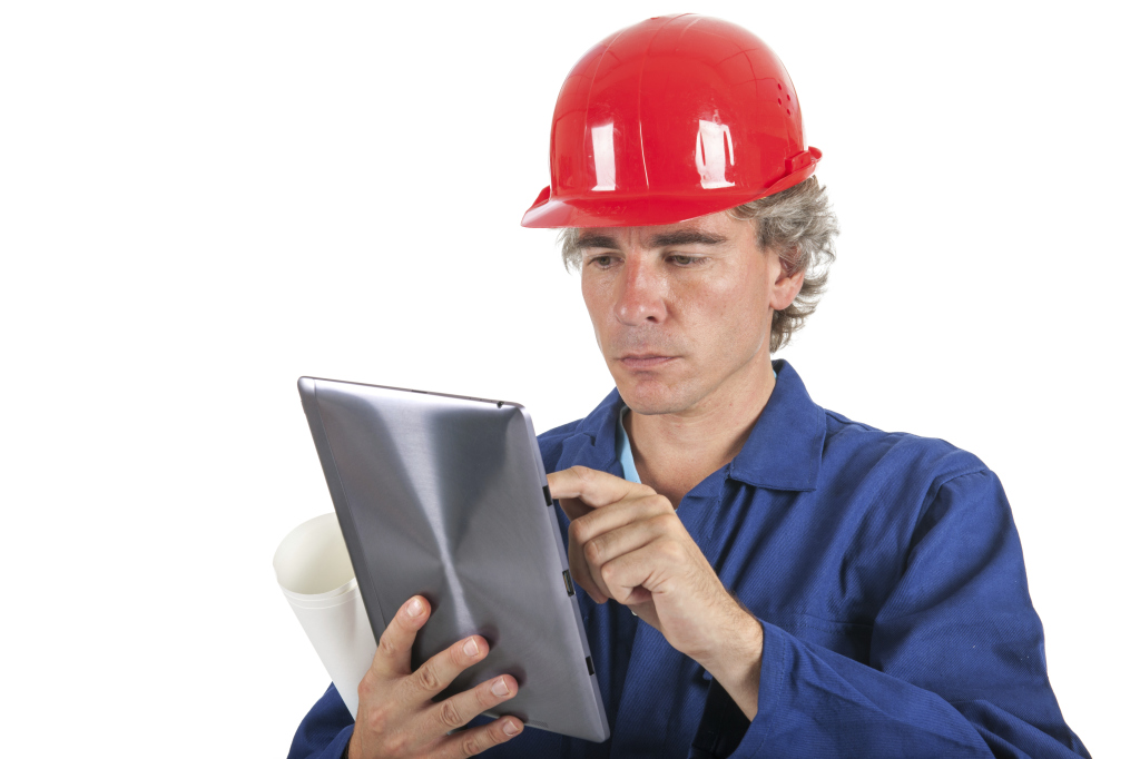 Concerned Construction Worker On Tablet ThinkStock Image